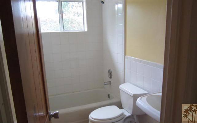 70160 Chappel Road Rancho Mirage, CA 92270 - Photo 6 of 11 a white toilet sitting next to a bath tub