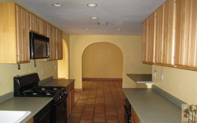 70160 Chappel Road Rancho Mirage, CA 92270 - Photo 8 of 11 a kitchen with a sink and a stove top oven