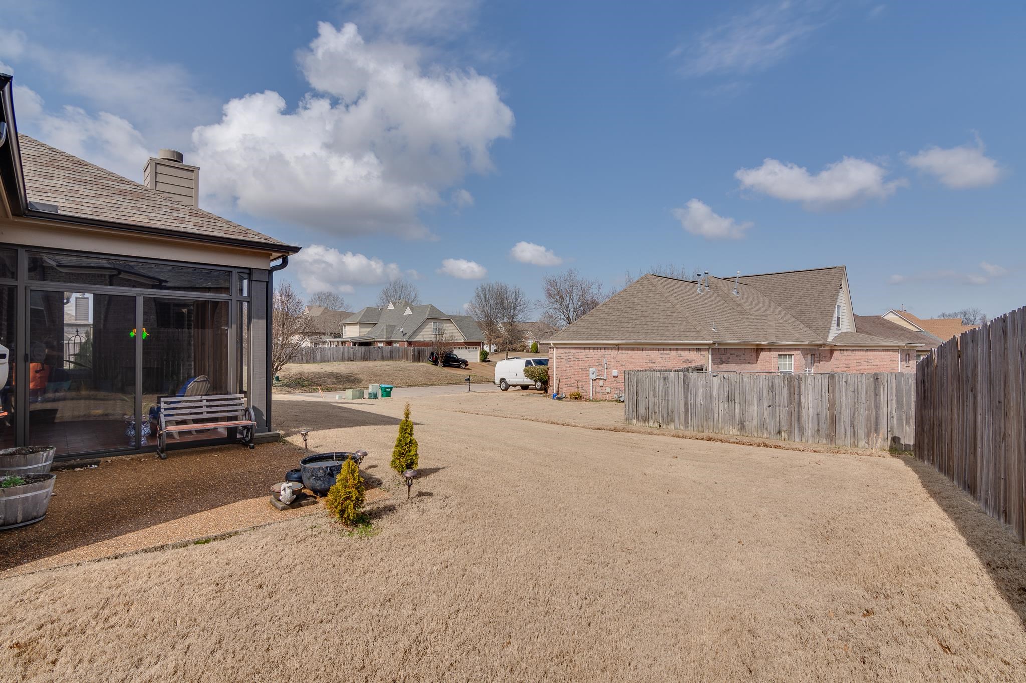135 Chesnut Rdg Drive Oakland, TN 38060 - Photo 32 of 36 View of yard with a residential view and a sunroom