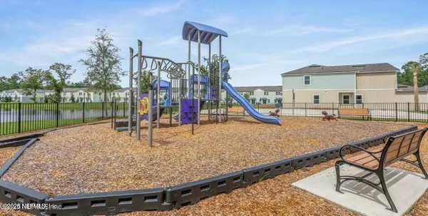 a view of a backyard with a slide