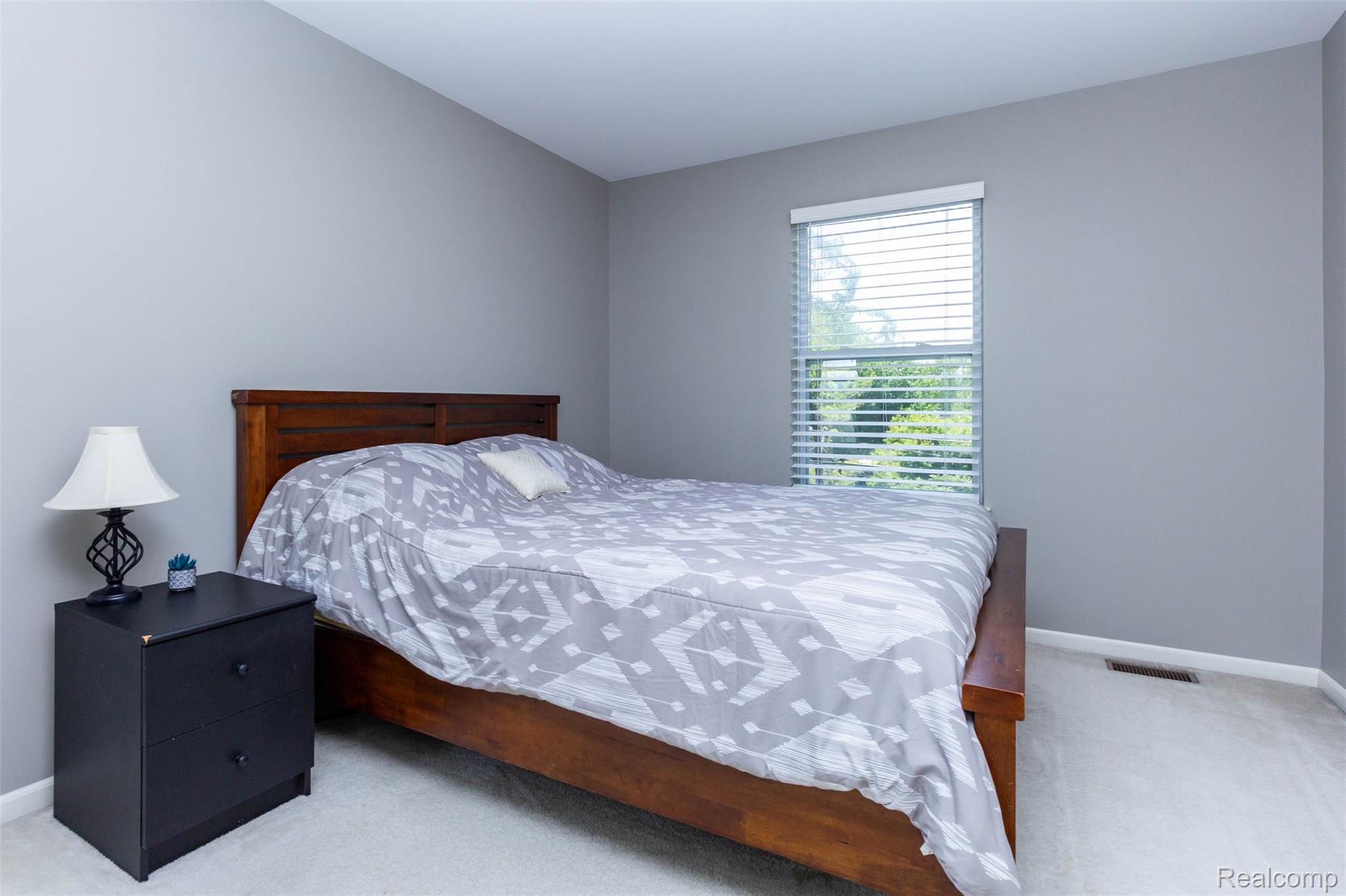 36039 Curtis Road Livonia, MI 48152 - Photo 33 of 61 Carpeted room featuring a window with blinds, light gray walls, and white trim