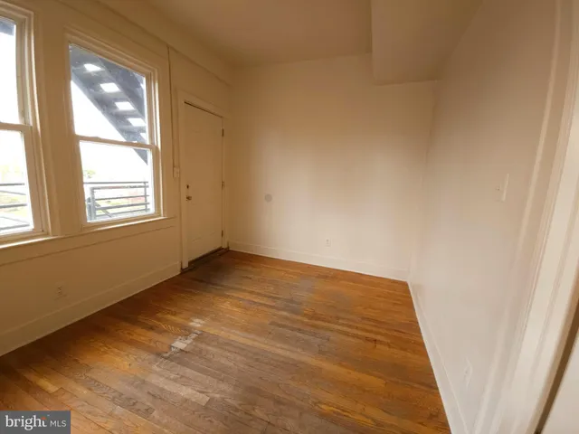 a view of an empty room and window