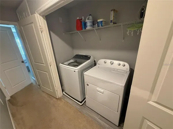 a utility room with dryer and washer