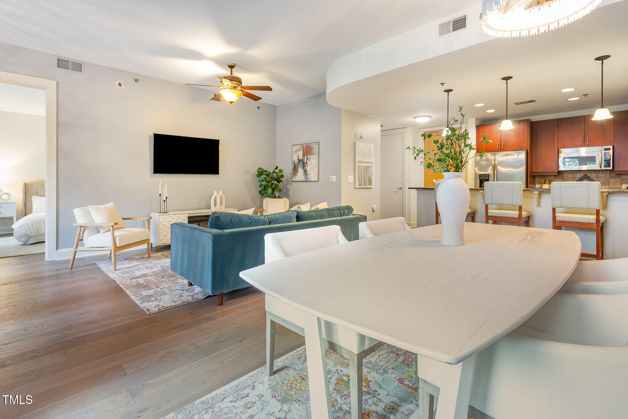 616 North Boylan Avenue, Unit 520 Raleigh, NC 27603 - Photo 11 of 24 a large white kitchen with a table and chairs
