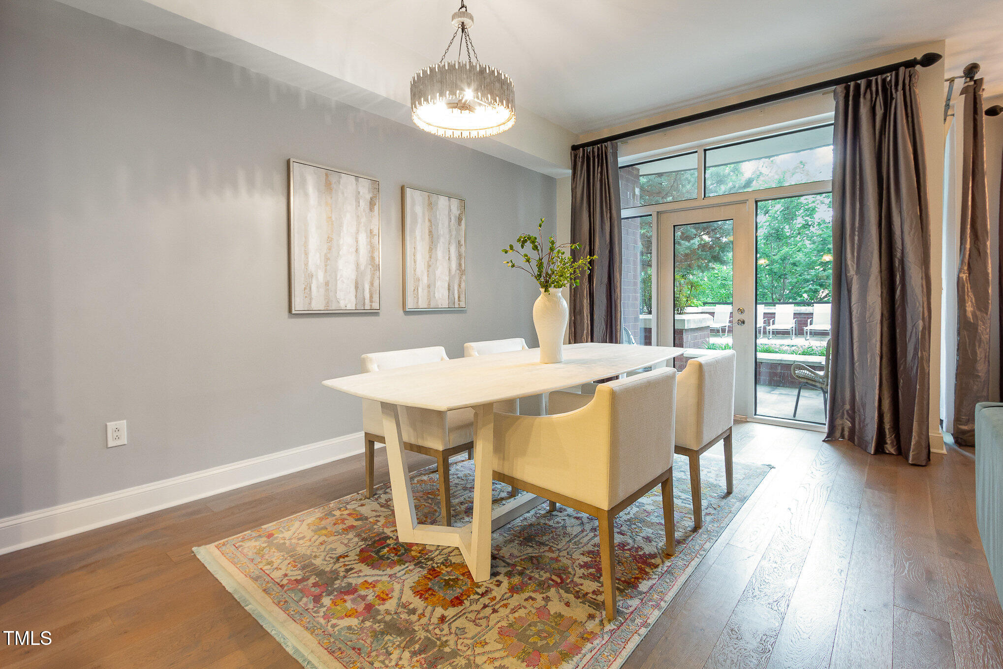 616 North Boylan Avenue, Unit 520 Raleigh, NC 27603 - Photo 12 of 24 a view of a dining room with furniture window and wooden floor