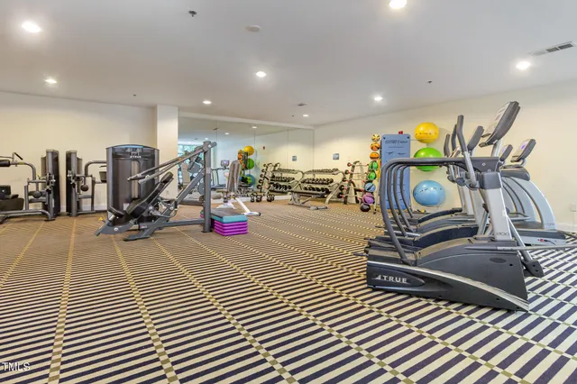 a room with lots of gym equipment
