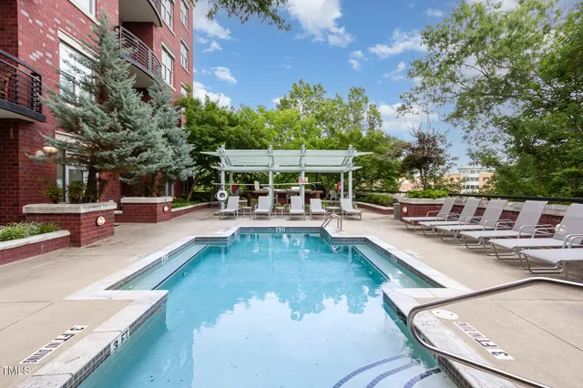 a view of a swimming pool with chairs