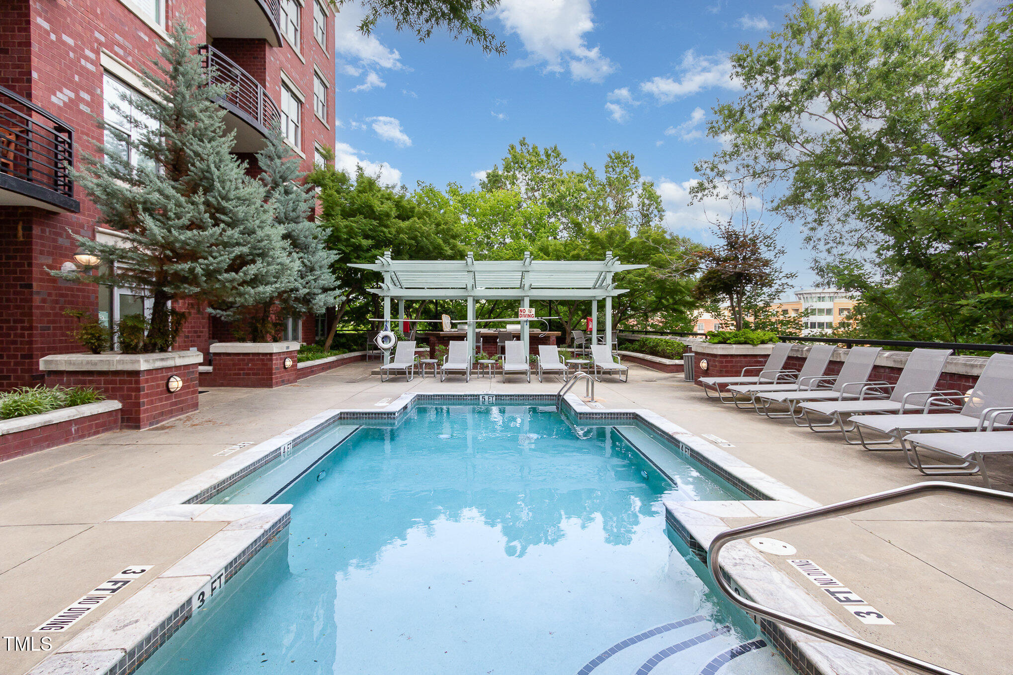 616 North Boylan Avenue, Unit 520 Raleigh, NC 27603 - Photo 23 of 24 a view of a swimming pool with chairs