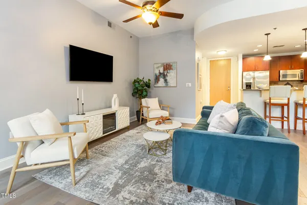 a living room with furniture and a flat screen tv