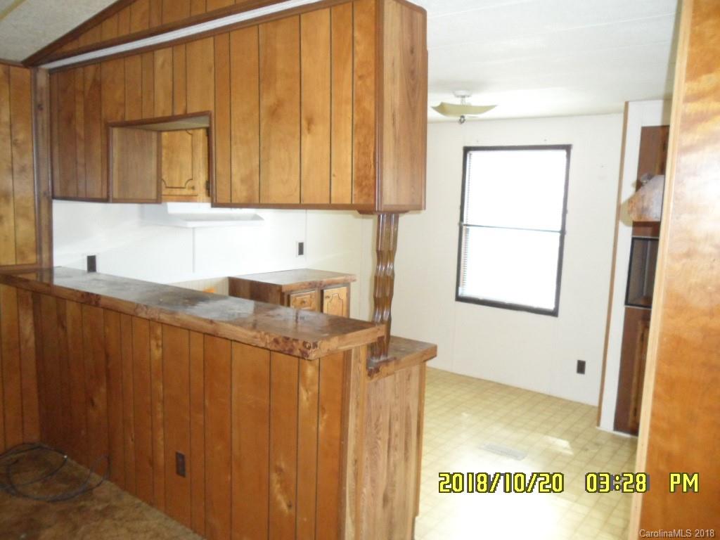 786 Crabtree Church Road Clyde, NC 28721 - Photo 3 of 30 a bathroom with a sink and a mirror