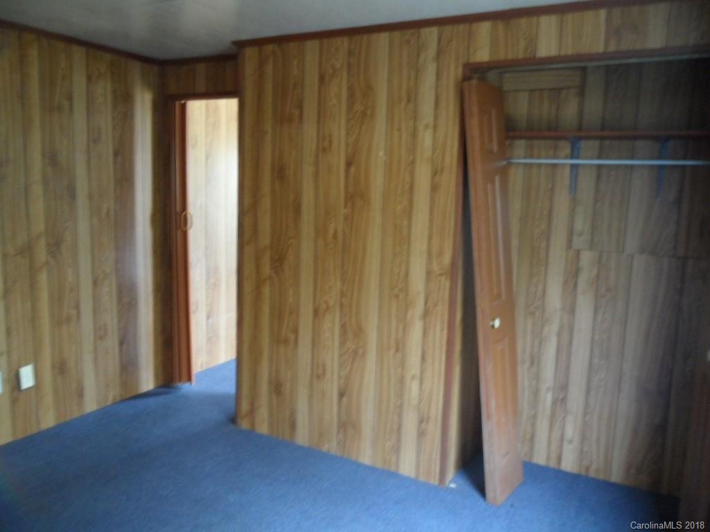 786 Crabtree Church Road Clyde, NC 28721 - Photo 22 of 30 a view of a hallway with wooden floor