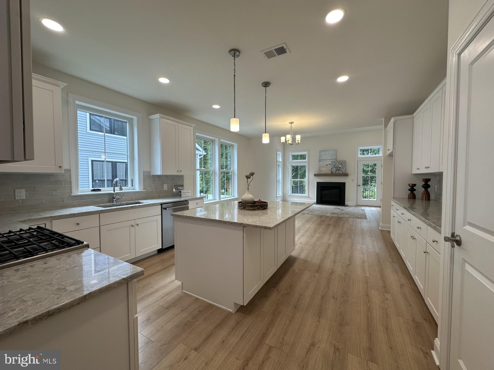 61 Kay Chiarello Way Hamilton, NJ 08690 - Photo 1 of 21 a kitchen with counter top space a sink appliances and cabinets