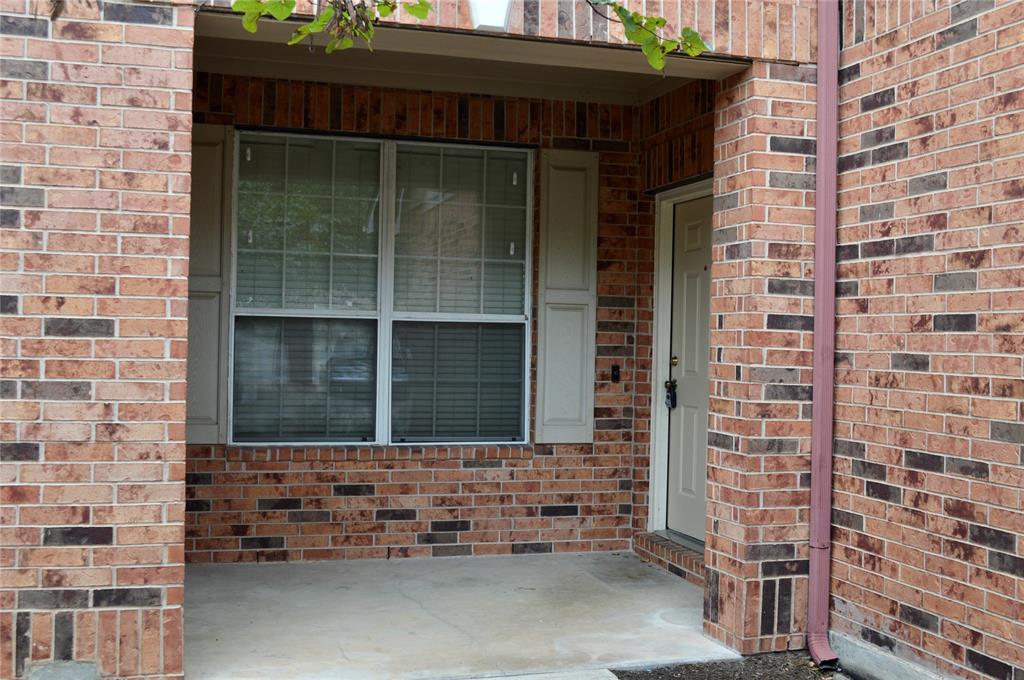 13 Verde Ranch Loop Leander, TX 78641 - Photo 1 of 18 A covered concrete entryway is framed by classic brick walls.