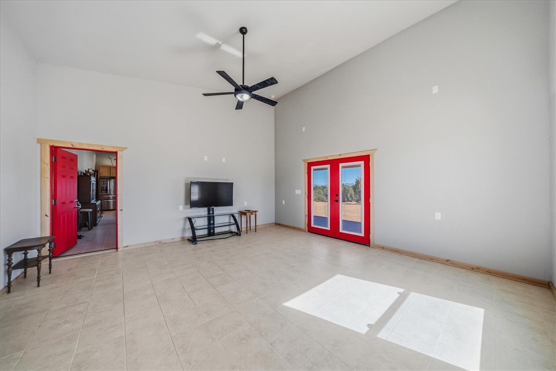10374 East Happy Trails Road Kingman, AZ 86401 - Photo 24 of 68 a living room with furniture and a ceiling fan