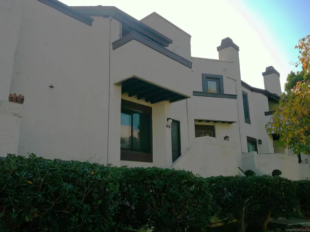 a kitchen with stainless steel appliances a refrigerator sink and microwave