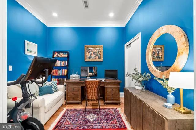 a living room with furniture a rug and a large window