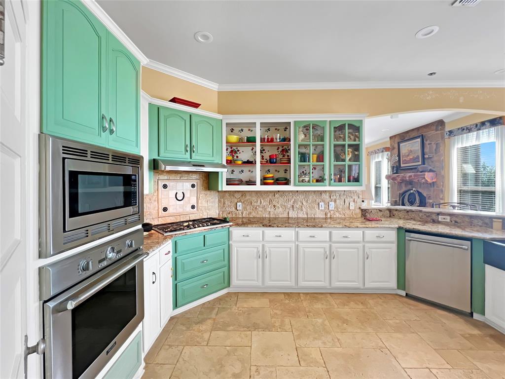 590 County Road 385 Valley View, TX 76272 - Photo 12 of 38 a kitchen with stainless steel appliances granite countertop a stove and a microwave
