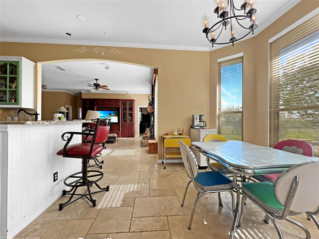 590 County Road 385 Valley View, TX 76272 - Photo 13 of 38 a view of a dining room with furniture and chandelier