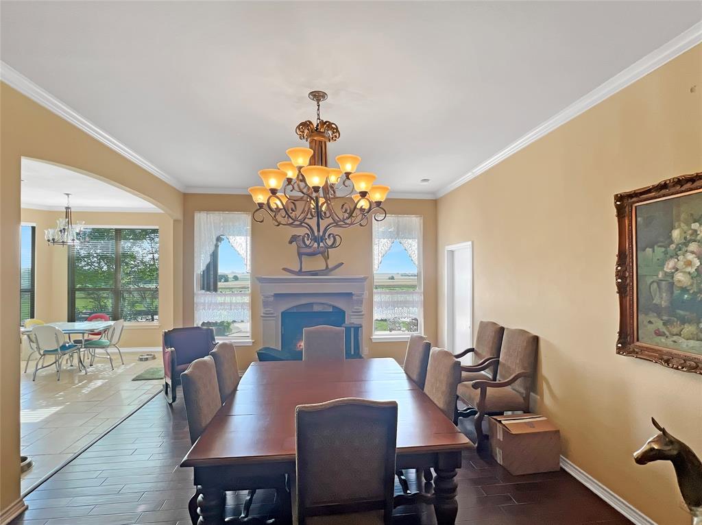 590 County Road 385 Valley View, TX 76272 - Photo 14 of 38 a view of a dining room with furniture a chandelier and wooden floor