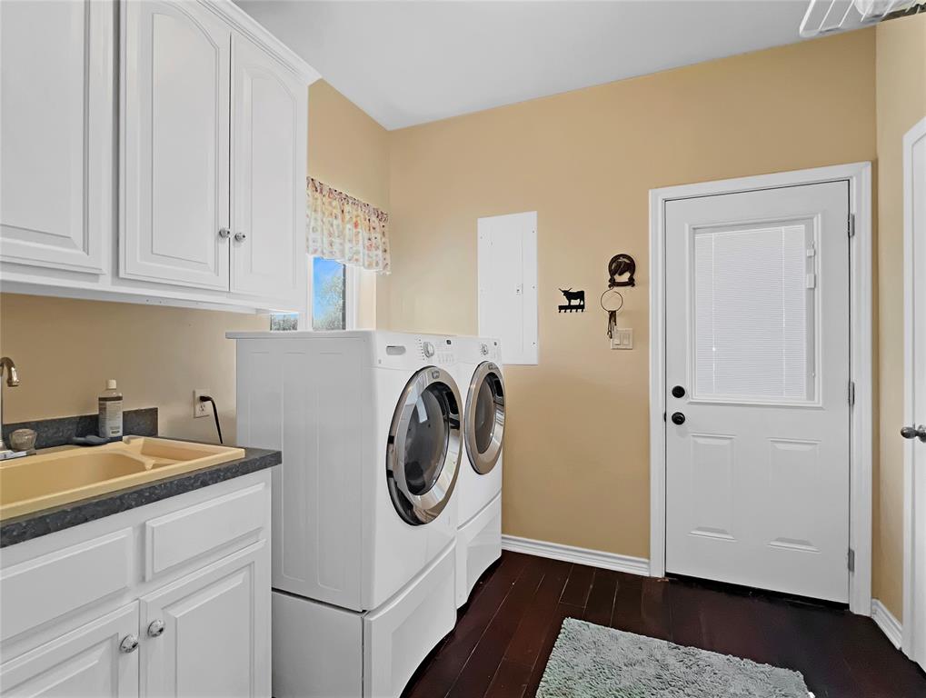 590 County Road 385 Valley View, TX 76272 - Photo 15 of 38 a utility room with sink dryer and washer