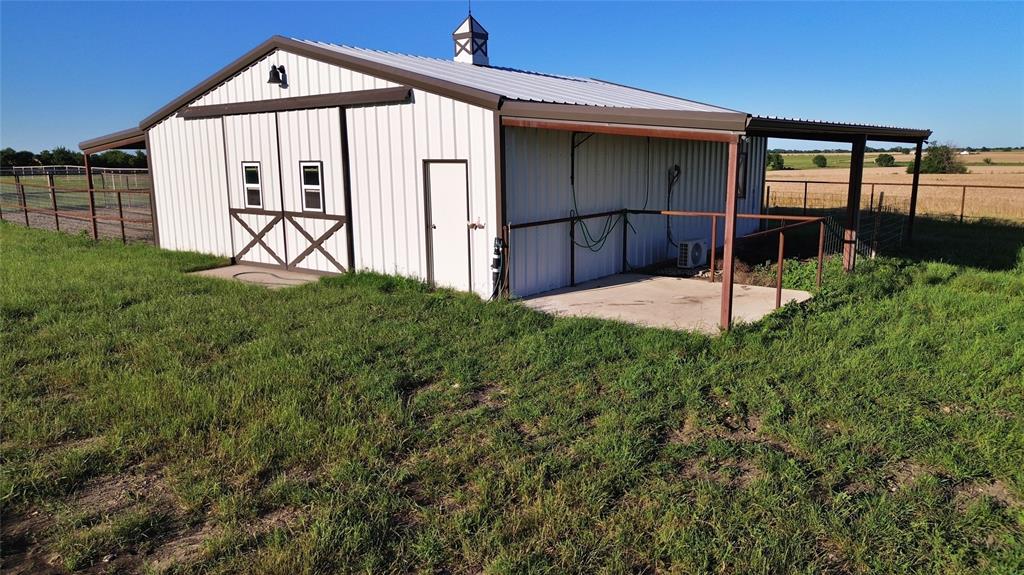590 County Road 385 Valley View, TX 76272 - Photo 29 of 38 a front view of a house with garden
