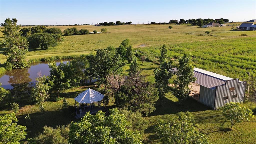 590 County Road 385 Valley View, TX 76272 - Photo 30 of 38 an aerial view of ocean with residential house with outdoor space and trees