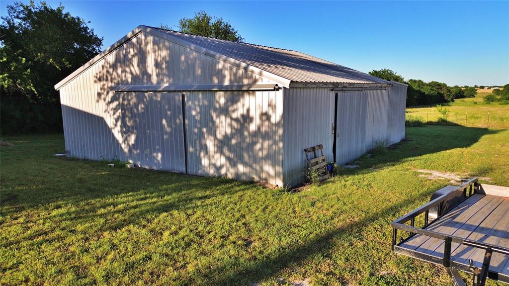 590 County Road 385 Valley View, TX 76272 - Photo 33 of 38 a backyard of a house with wooden fence