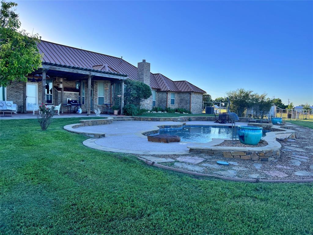 590 County Road 385 Valley View, TX 76272 - Photo 35 of 38 a front view of a house with a yard