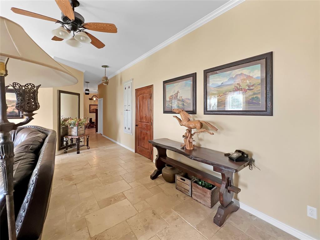 590 County Road 385 Valley View, TX 76272 - Photo 6 of 38 a view of a livingroom with workspace and a window