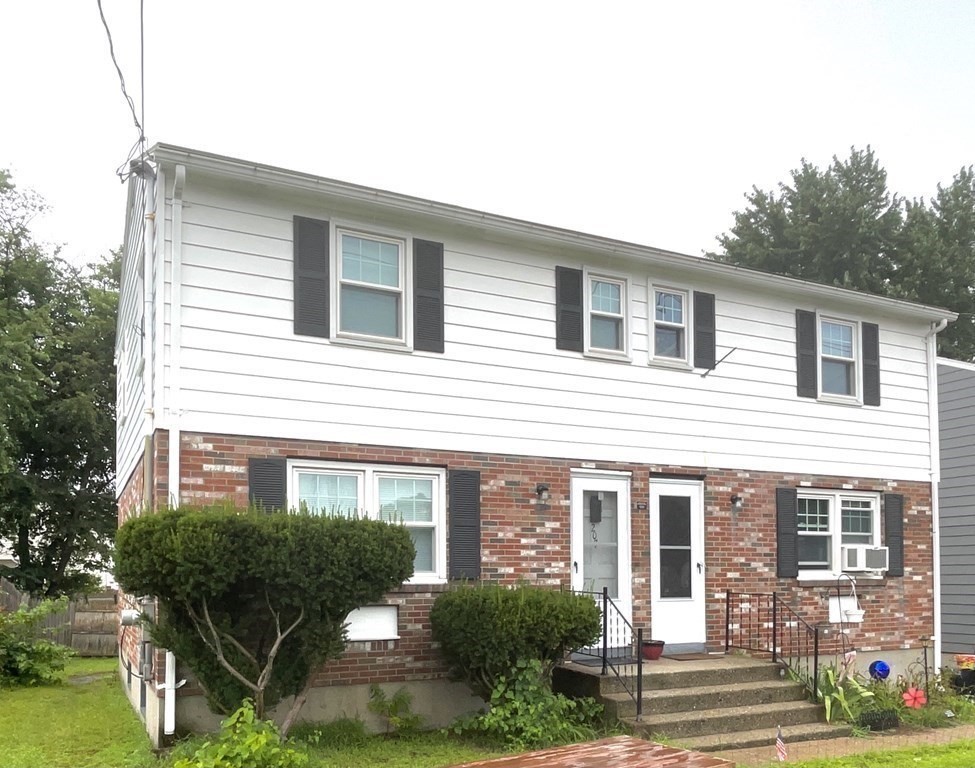 205-207 Nottingham Street Springfield, MA 01104 - Photo 24 of 25 a front view of a house with garden