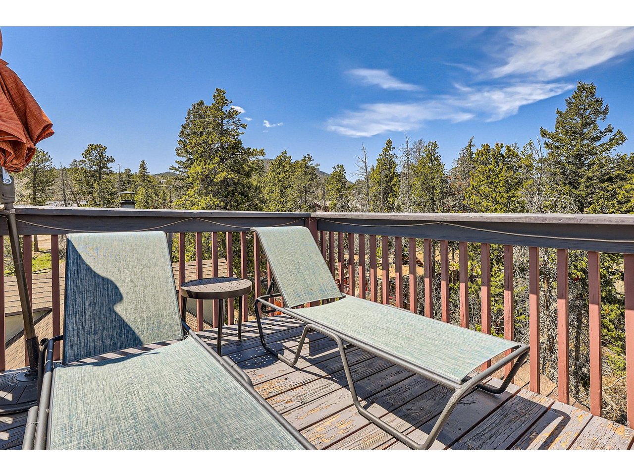 33 L Road Golden, CO 80403 - Photo 29 of 37 Cozy up with a warm toddy or enjoy a refreshing glass of lemonade on the deck while taking in the stunning mountain scenery.