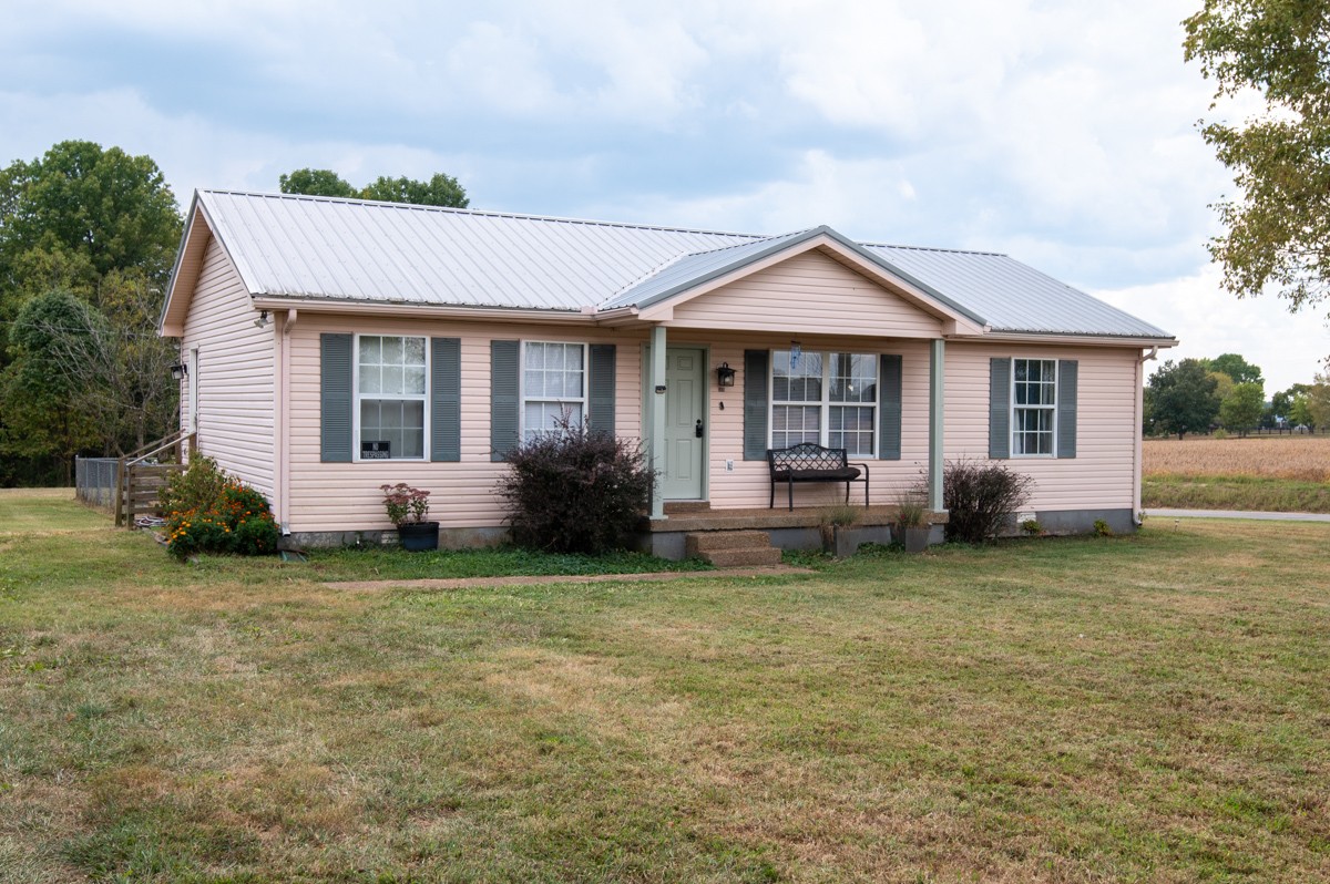 560 Gregory Road Westmoreland, TN 37186 - Photo 11 of 41 a view of a house with backyard and porch