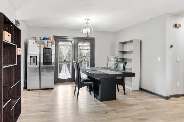 a kitchen with stainless steel appliances granite countertop a sink refrigerator and cabinets