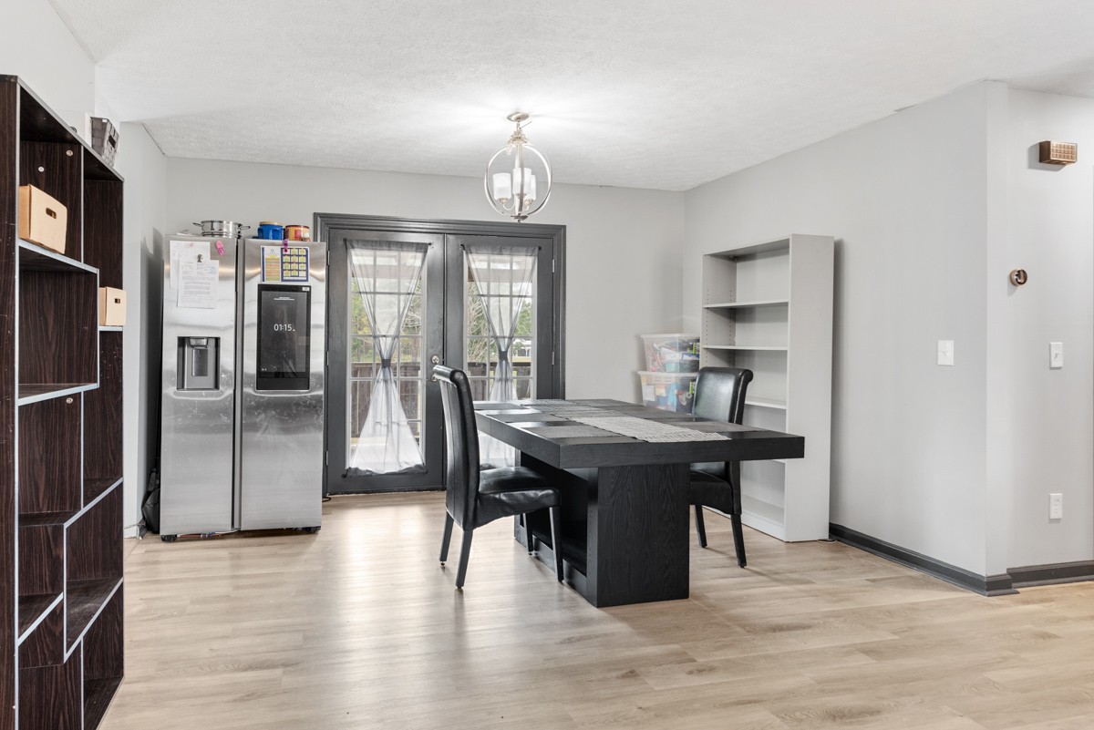 560 Gregory Road Westmoreland, TN 37186 - Photo 18 of 41 a kitchen with stainless steel appliances granite countertop a sink refrigerator and cabinets