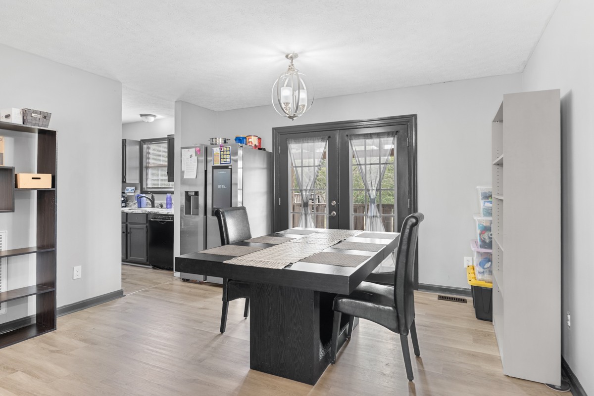560 Gregory Road Westmoreland, TN 37186 - Photo 19 of 41 a view of a dining room with furniture window and wooden floor