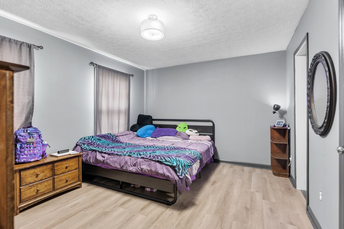 560 Gregory Road Westmoreland, TN 37186 - Photo 24 of 41 a bedroom with a bed and a dresser