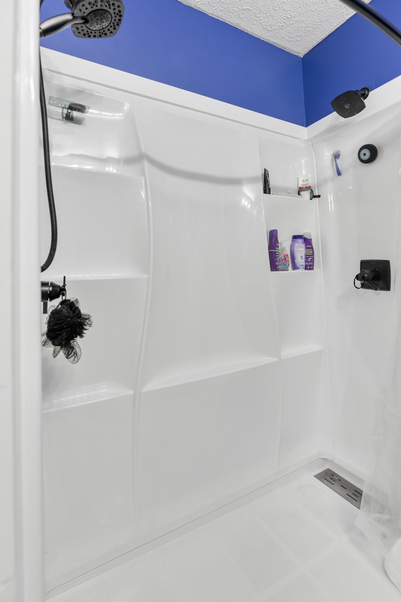 560 Gregory Road Westmoreland, TN 37186 - Photo 27 of 41 a white bath tub sitting next to a white sink