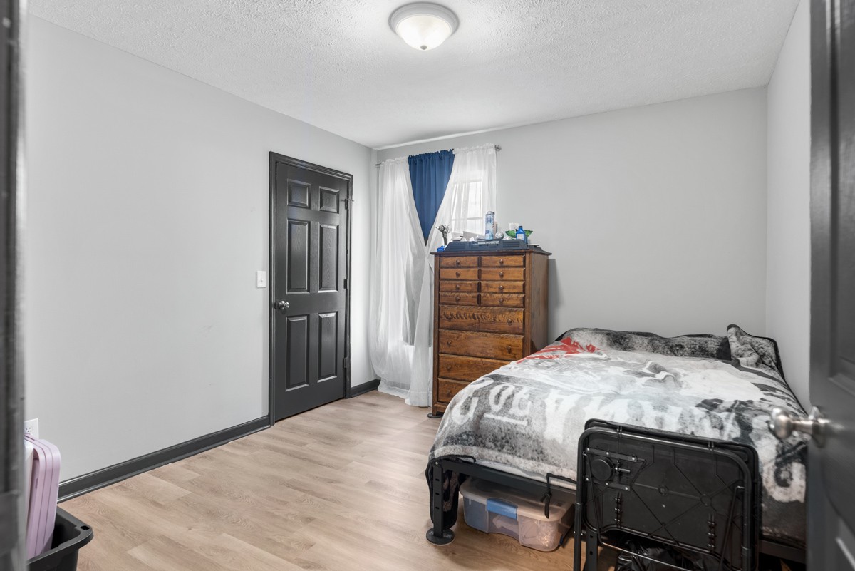 560 Gregory Road Westmoreland, TN 37186 - Photo 30 of 41 a bedroom with a bed and a dresser