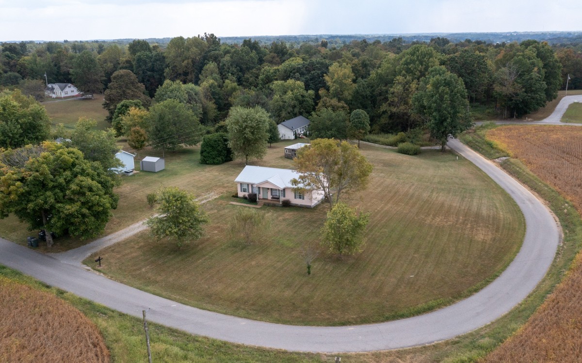 560 Gregory Road Westmoreland, TN 37186 - Photo 3 of 41 a view of a swimming pool with a yard