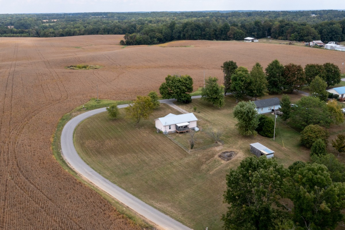560 Gregory Road Westmoreland, TN 37186 - Photo 38 of 41 an aerial view of a house with outdoor space and lake view