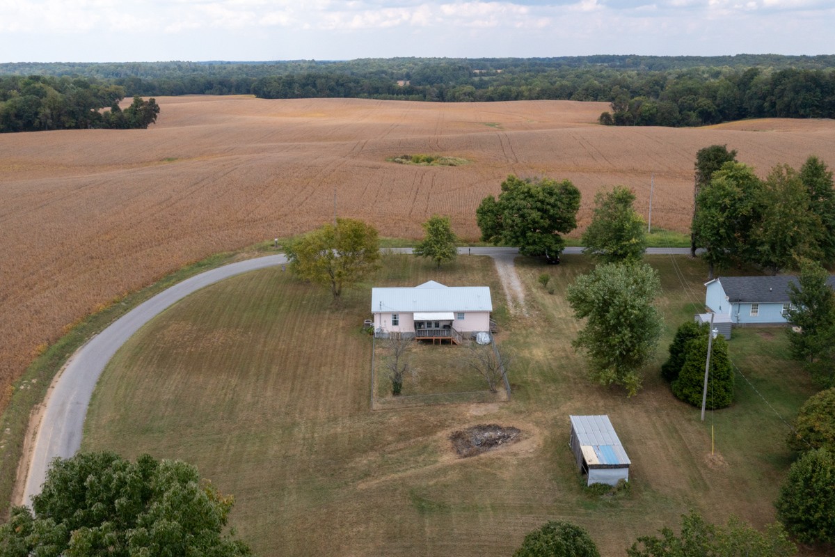 560 Gregory Road Westmoreland, TN 37186 - Photo 39 of 41 an aerial view of a house with a lake view