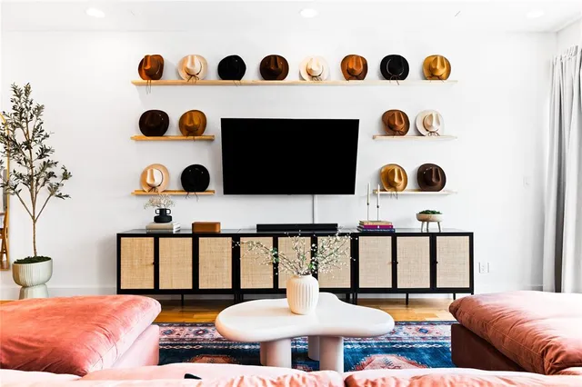 a bedroom with a bed and a painting on the wall