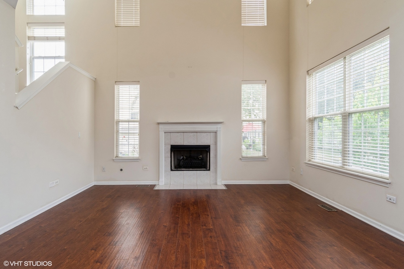 2966 White Thorn Circle Naperville, IL 60564 - Photo 2 of 15 an empty room with wooden floor and windows