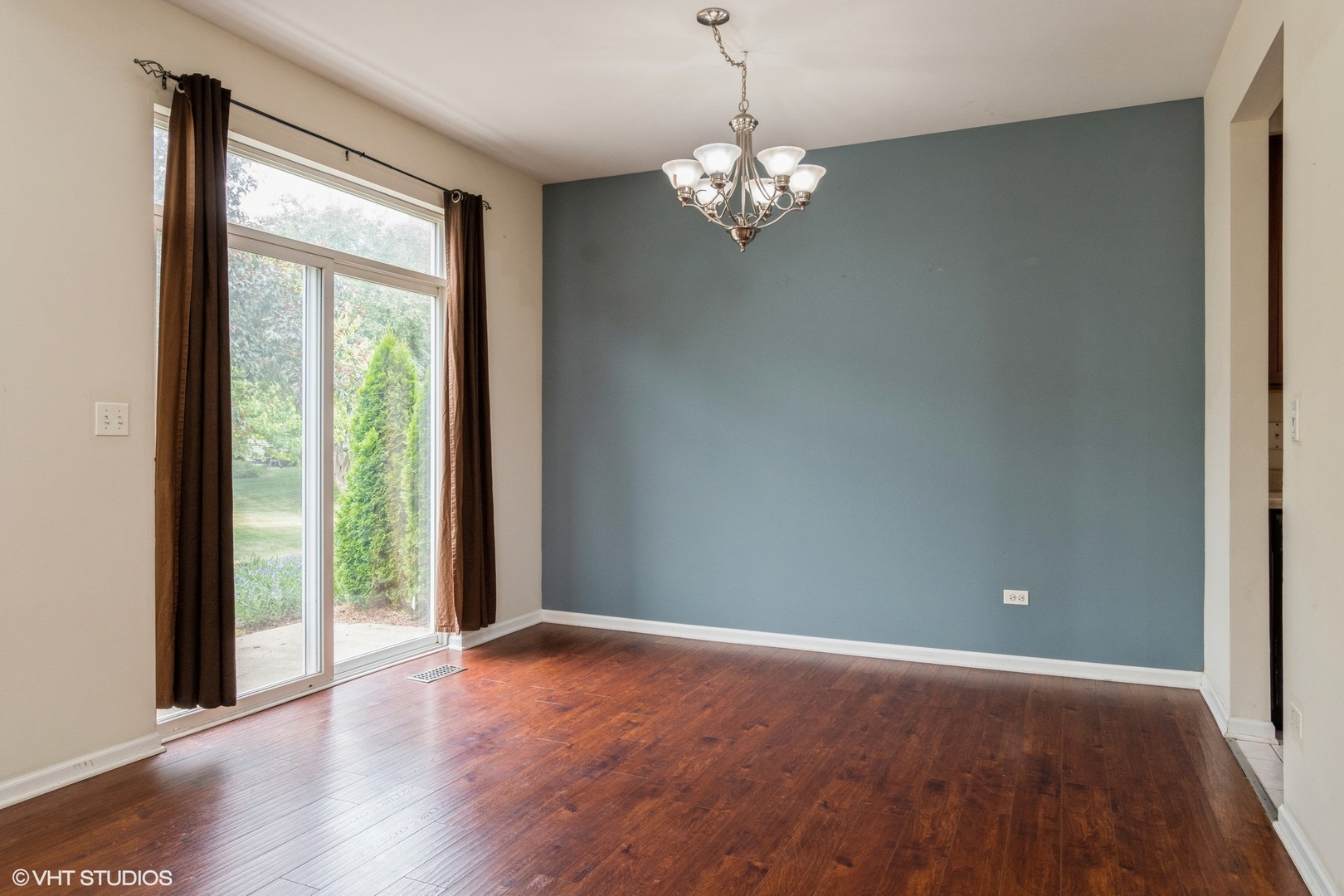 2966 White Thorn Circle Naperville, IL 60564 - Photo 6 of 15 a view of empty room with wooden floor and fan