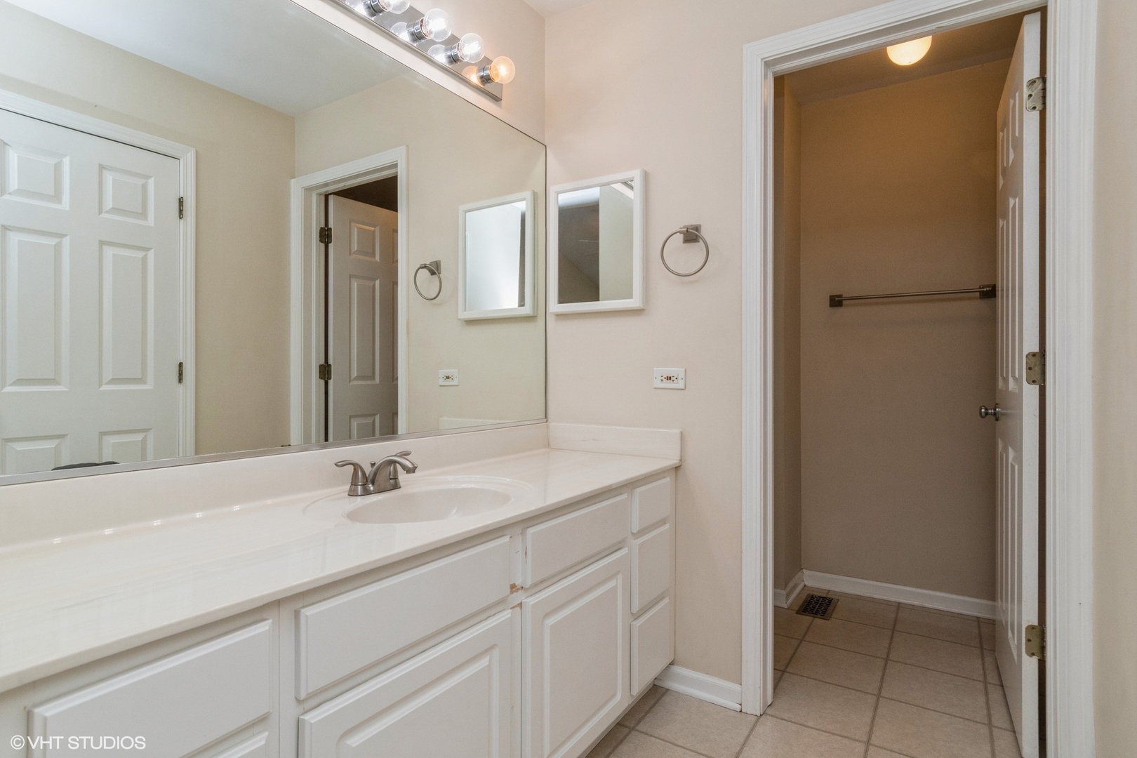 2966 White Thorn Circle Naperville, IL 60564 - Photo 9 of 15 a bathroom with a sink and a mirror