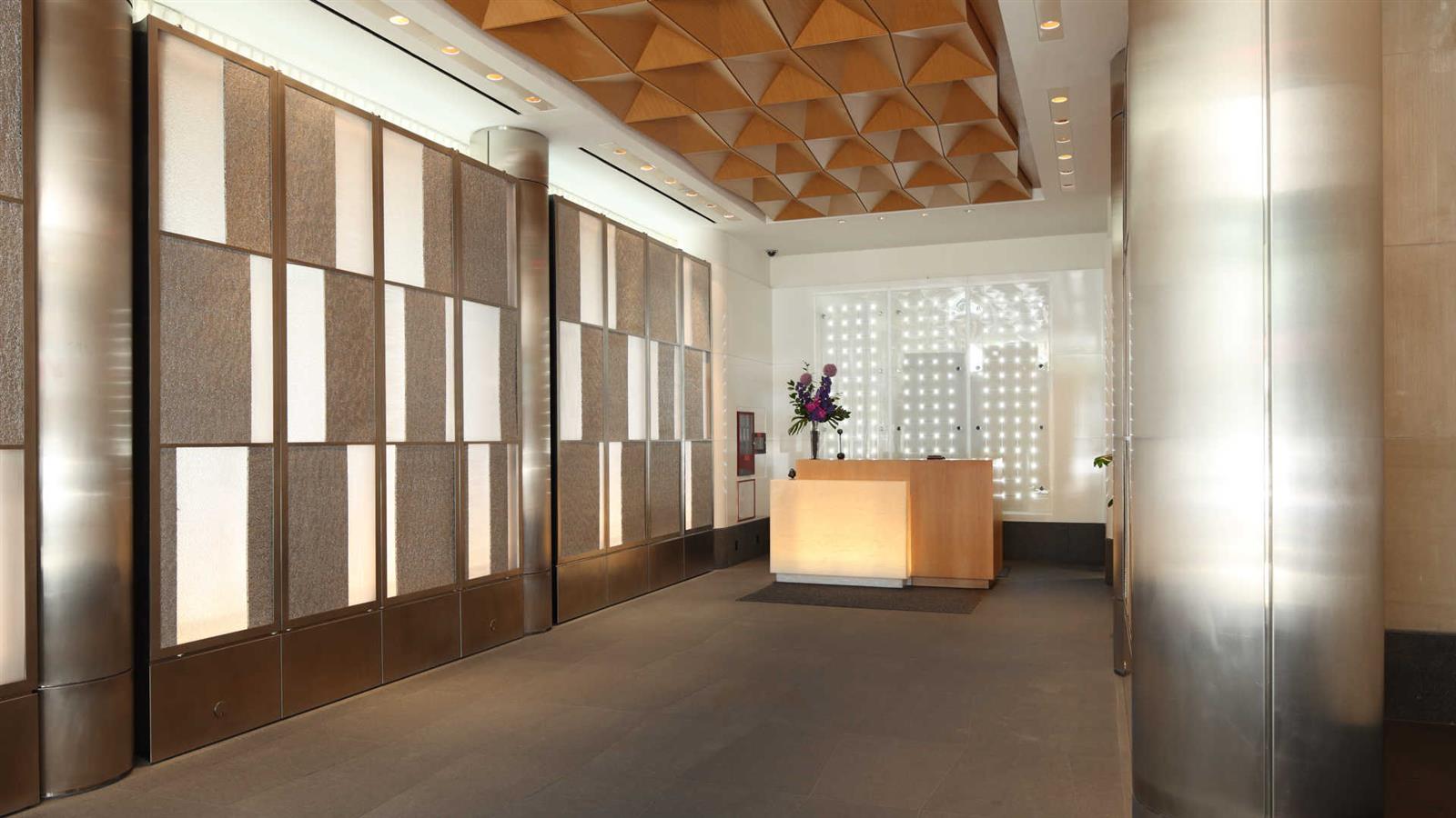 105 West 29th Street, Unit 35G Manhattan, NY 10001 - Photo 3 of 10 a living room with large windows