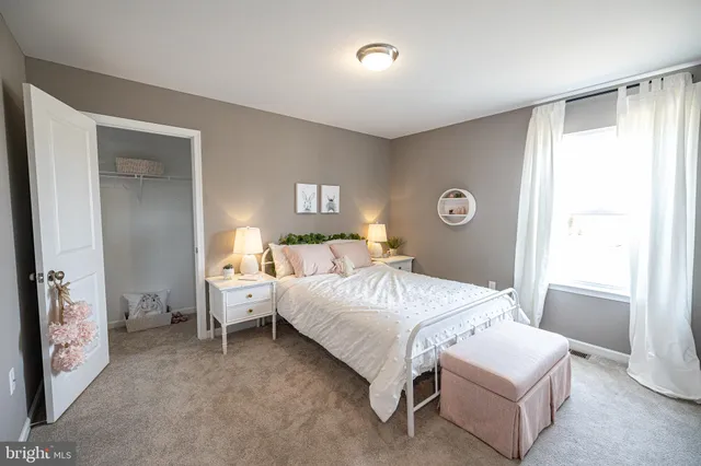 a room with a bed and a window