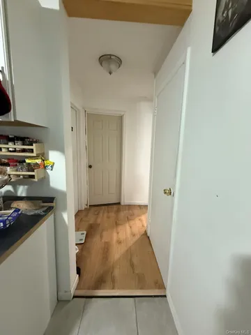 a view of a kitchen from the hallway