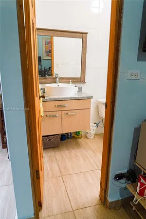 a bedroom with a bed and a table in it