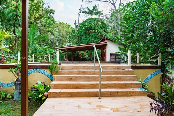 a view of a water fountain in front of house